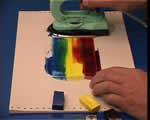 spread the wax colours onto the painting card - an encaustic art project shown on the "Learn the SKills Video" by Michael Bossom