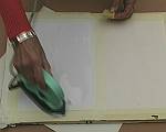 Cover the card with clear wax medium using the iron